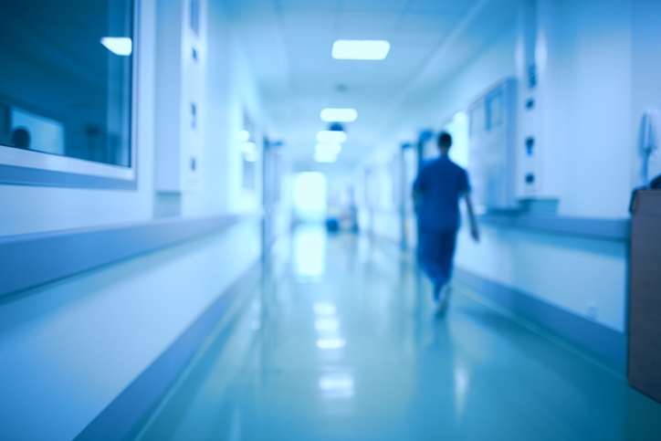 Hospital corridor and doctor as a blurred out of focus background