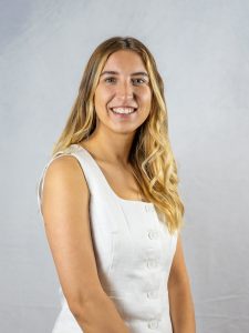 Headshot of Nichole Sasi, who is wearing a white top