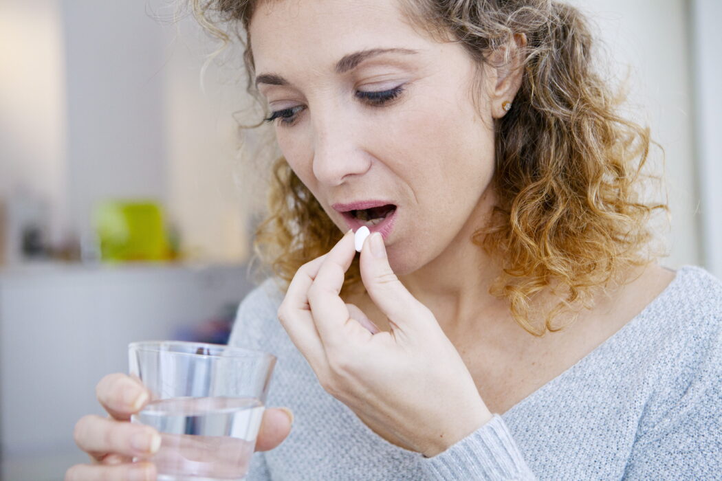 woman-taking-medication